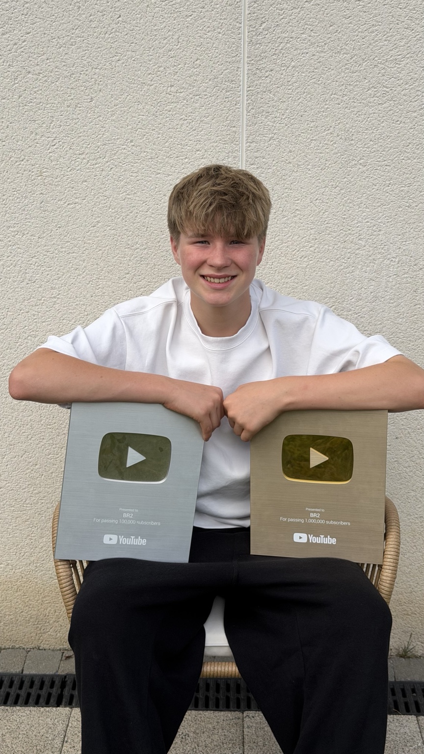 Leo Barnes with his silver and gold YouTube awards