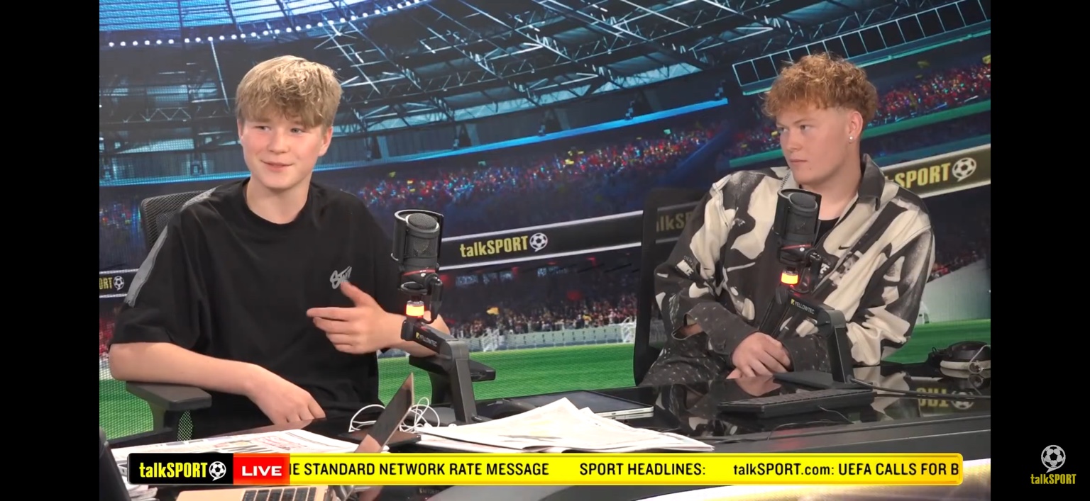 Leo speaking into a microphone in the talkSPORT studio